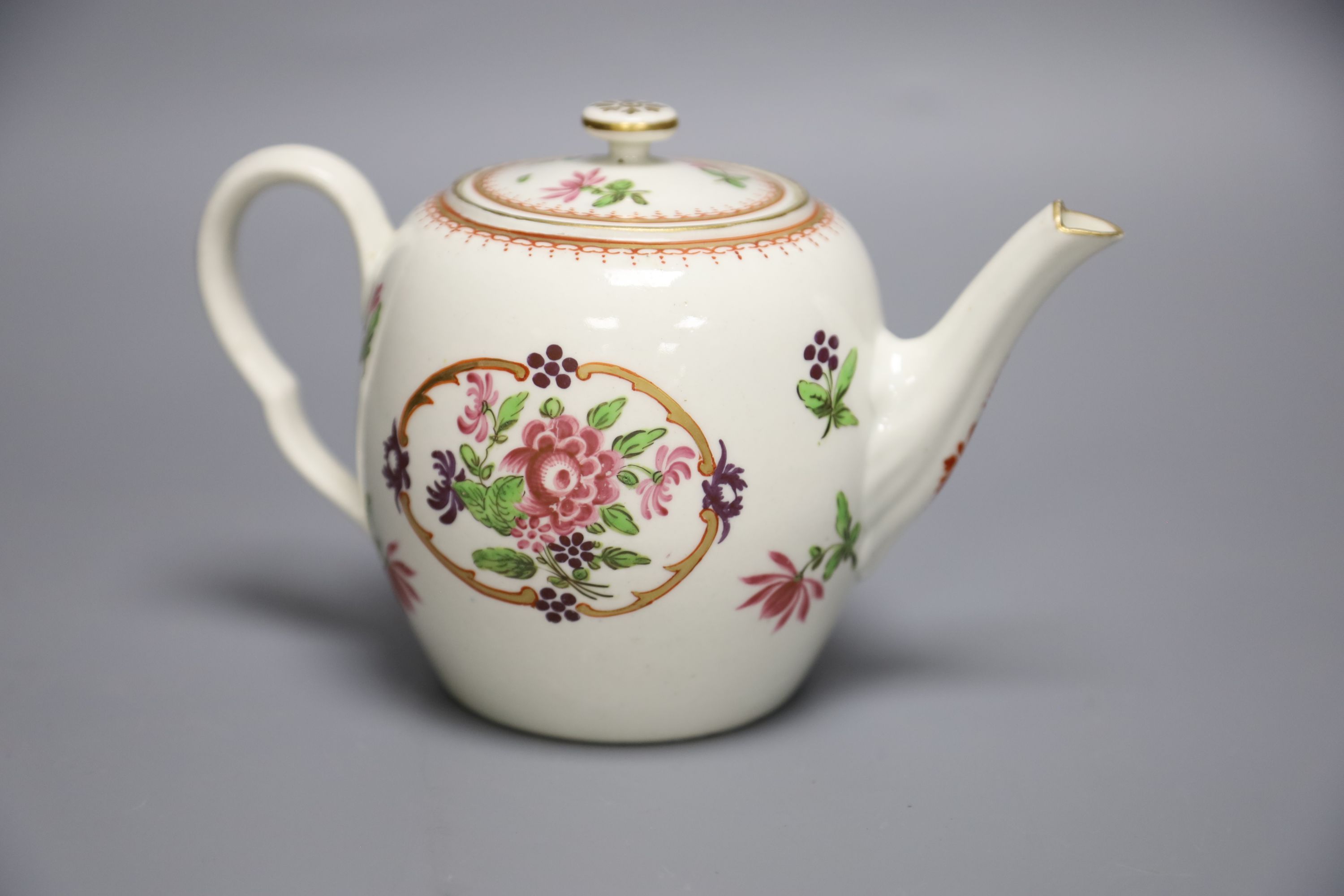 An 18th century Worcester fine teapot and cover of Companie des Indes type painted with Chinese flowers, height 12cm